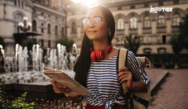 Form 8843 for J-1 scholars: university researcher filing federal tax form at desk
