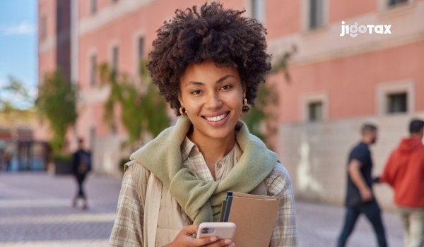 J-1 visa holder from France reviewing tax treaty benefits and income tax forms for nonresident aliens