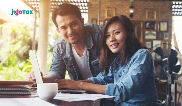 J-1 visa holder reviewing W-2 form to identify double FICA withholding taxes